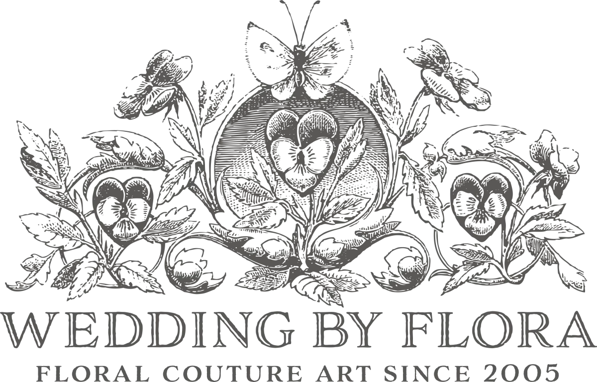 A black and white image of a wedding by flora logo